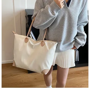 Large capacity nylon travel tote bag with leather handles for women, casual daily luggage.