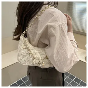 Woven straw underarm bag for women, chic chain strap and shell pearl pendants, stylish beach purse.