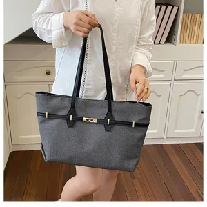 Vintage large capacity women tote bag, stylish commuting shoulder bag with chic lock design.