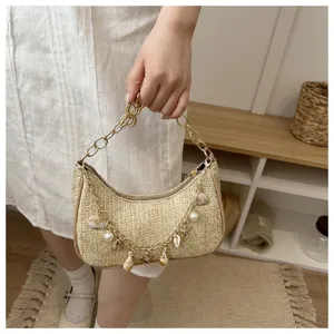 Woven straw underarm bag with shell pearl chain detail for beach casual summer fashion