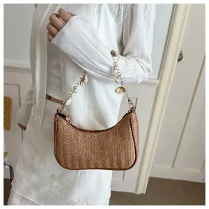 Woven straw underarm bag with pearl shell chain strap, stylish summer beach shoulder bag.