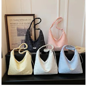 Detailed view of fashionable star print hobo bags in multiple colors with stylish straps.