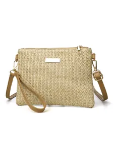 Straw woven crossbody bag stylish summer beach shoulder bag with detachable PU leather strap.