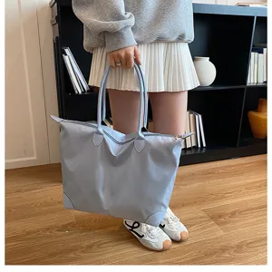 Women large capacity travel duffel bag, nylon waterproof tote for gym and short trips.