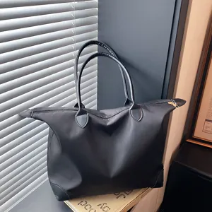 Large capacity black nylon travel tote bag, waterproof shoulder handbag for women.