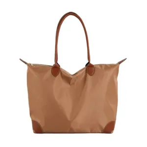 Large capacity travel tote bag for women, lightweight nylon material with brown leather handles.