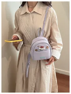 Joli mini sac à dos pour femme, sac bandoulière violet avec patch chien en peluche.