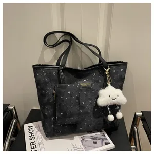 Black star moon pattern tote bag with small pouch and cloud pendant for daily casual commuting.