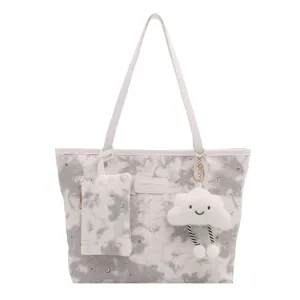 Casual large capacity shoulder bag with starry print, cute cloud pendant and a matching pouch.