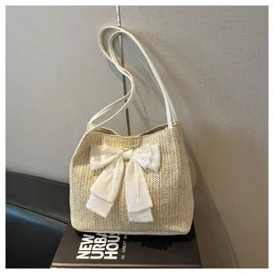 Large straw shoulder bag with elegant white bow detail, perfect for summer casual daily use and stylish tote.