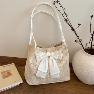 Chic straw woven shoulder bag with big white bow, large capacity aesthetic summer tote bag.