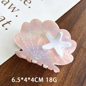 Ocean style pink shell hair claw clip with white starfish design, elegant hairpin accessory.