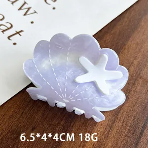 Purple acetate shell hair claw clip with white starfish detail for women hair styling detail.