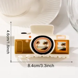 Cute camera shaped hair claw clip, summer beach palm tree print, close-up product detail view
