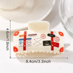Cute suitcase shaped hair claw clip with vintage travel stickers, resin hair accessory for women.