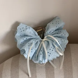Blue eyelet lace hair claw clip with white ribbon bow sweet girl hair accessory detail