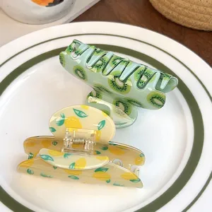 Joli set de pinces à cheveux fruitées kiwi et citron pour des coiffures fraîches et élégantes.