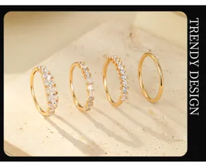 Detailed view of trendy gold silver ring set featuring four unique stackable designs with stones.