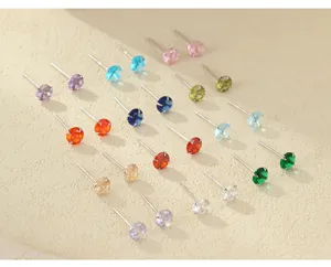 Close-up detail view of colorful round zircon stud earrings featuring vibrant colors.