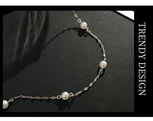 Detailed shot of S925 sterling silver starry faux pearl necklace, elegant minimalist choker.