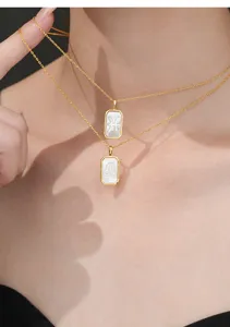 Double layer 18k gold plated necklace with white mother of pearl zodiac pendant detail shot.
