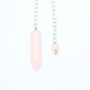 Detail view of natural rose quartz hexagonal pendulum pendant with silver chain accessories