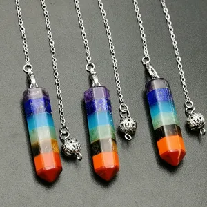 Detailed view of natural seven chakra crystal hexagonal column pendulum pendant with silver chain.