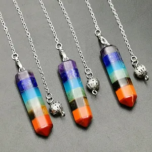 Close up view of seven chakra crystal hexagonal pillar pendulum necklace details and chain.
