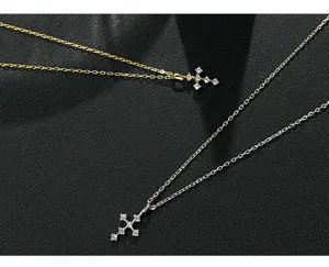 Silver and gold cross pendant necklaces featuring sparkling cubic zirconia stones for women.