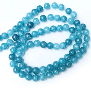 10mm blue cracked glass beads detail shot, showing clear ice texture and smooth round shape.