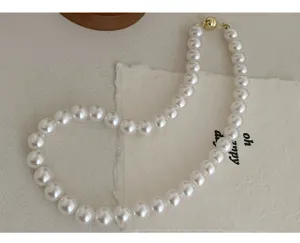 Elegant white pearl choker necklace with magnetic clasp, classic round beaded design for daily wear.