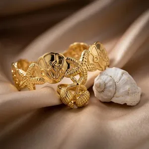 Set bracciale rigido aperto e anello con stella marina e conchiglia stile oceano oro