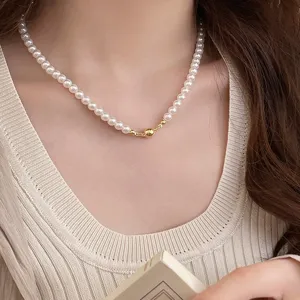 Elegant white pearl necklace with gold magnetic ball clasp for women, trendy chic clavicle chain.