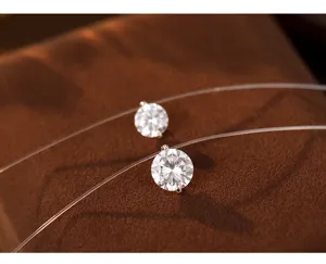 Close-up detail view of the sparkling moissanite solitaire pendant on transparent fishing line.