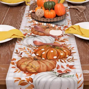 Autumn Thanksgiving table runner with pumpkin and maple leaf print, perfect for holiday dining decor.