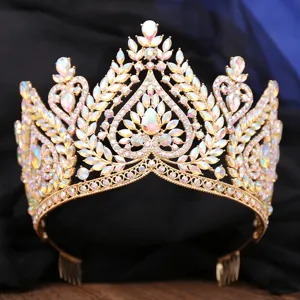 Exquisite baroque crystal bridal crown detail, sparkling iridescent AB rhinestones on gold tiara.