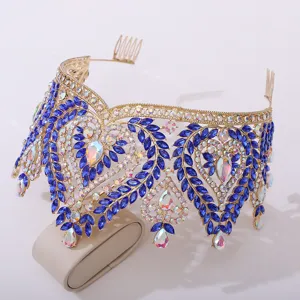 Detail view of baroque blue crystal bridal crown, featuring gold-toned metal and sparkling stones.