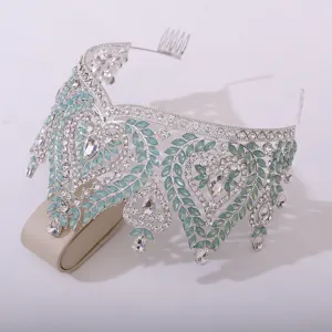 Detailed close-up view of silver baroque crystal bridal tiara with light blue rhinestones.