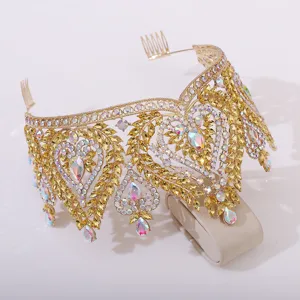 Gold baroque crystal bridal tiara detail, sparkling rhinestones and elegant leaf heart pattern design.