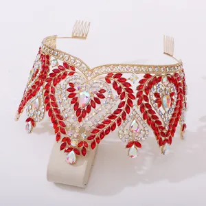 Detailed view of European bridal gold crown with vibrant red crystals and iridescent rhinestones.