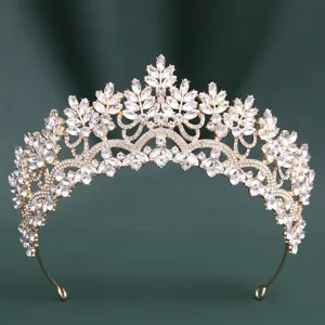 Detailed view of the sparkling crystal bridal tiara with marquise stones and gold finish.