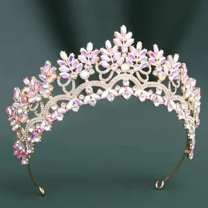 Exquisite detail of bridal crystal tiara with iridescent horse-eye stones and gold-plated band.