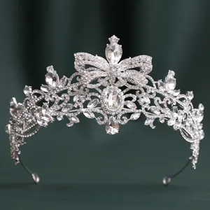 Exquisite rhinestone tiara detail, sparkling crystals with baroque bow design for wedding and party.