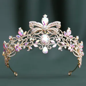 Exquisite baroque rhinestone bridal crown detail with butterfly motif and iridescent crystals.