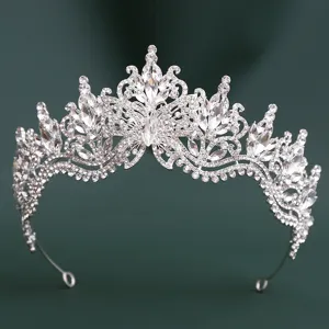 Detailed view of a stunning silver crystal rhinestone tiara crown with exquisite butterfly design.