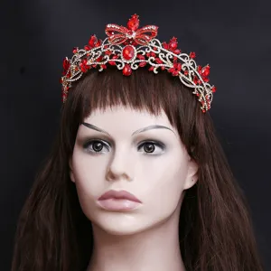 Close-up detail view of the exquisite red crystal baroque tiara featuring sparkling rhinestones.