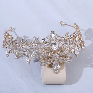 Exquisite baroque rhinestone bridal crown detail, gold butterfly tiara for wedding party.
