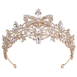Close-up detail of luxury gold crystal bridal tiara crown with elegant bow rhinestone.