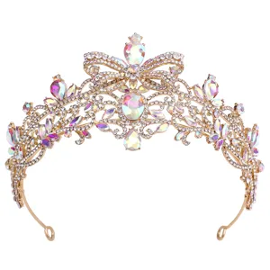 Detailed view of gold Baroque bridal tiara with rhinestones, bow design and AB crystals.