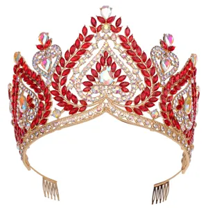 Detailed close-up of gorgeous gold baroque tiara featuring sparkling red and iridescent crystals.